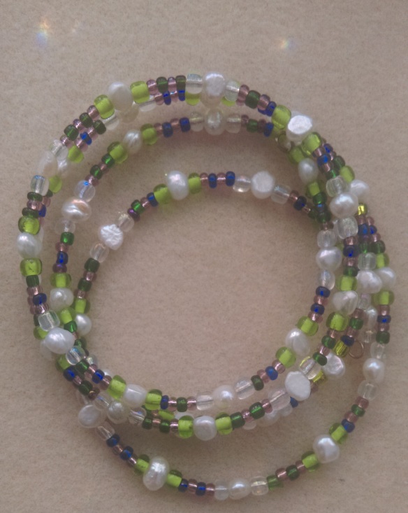 four layered, natural pearls & seed beads. 